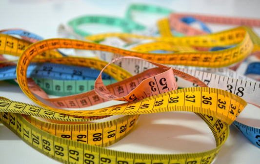 Assorted colorful tailor's measuring tapes for garment sizing
